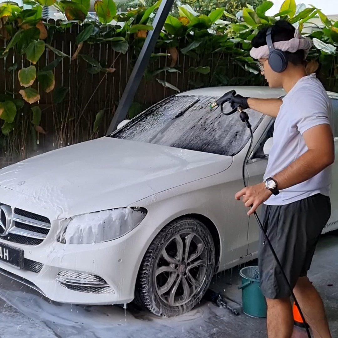 Car covered in snow foam during a detailed wash